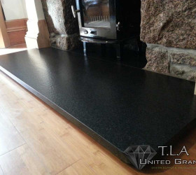 Black granite fireplace