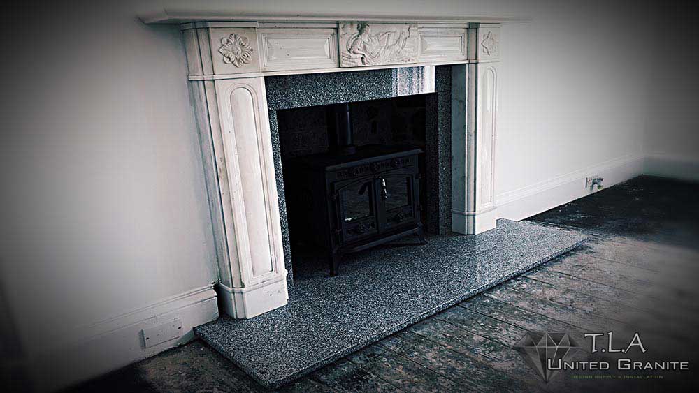 Black and white granite fireplace